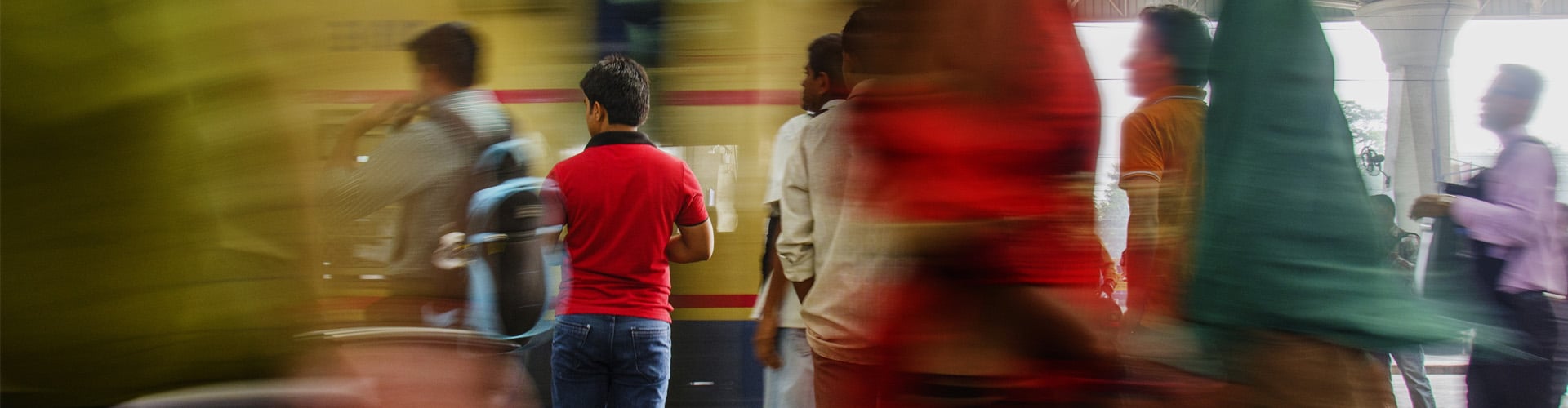 Train station in India with different people waiting for a train -