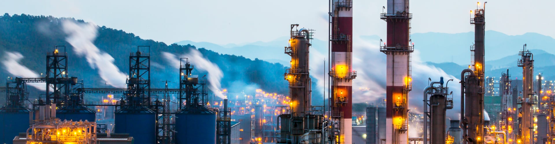 Power plant with mountain backdrop